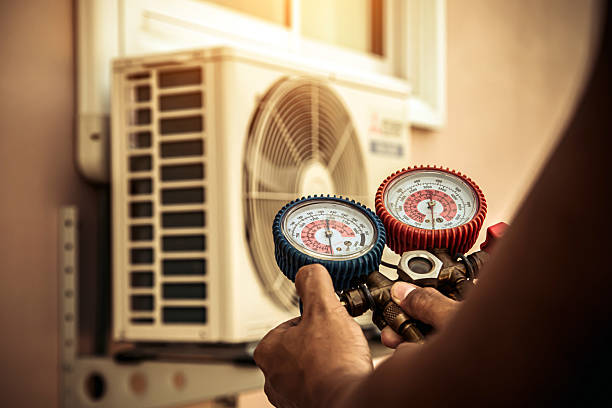 Professional Air Conditioning Service technician working in Stillwater, MN